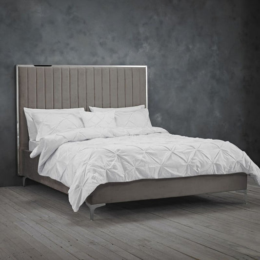 White headboard bed with grey sheets.