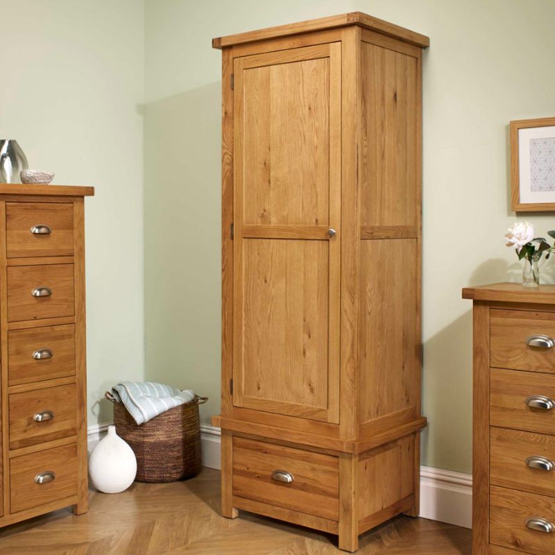 A wooden wardrobe with drawers and a dresser.