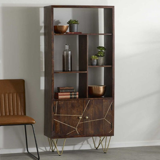 Wooden bookcase with chair and plants, creating a cozy reading nook.