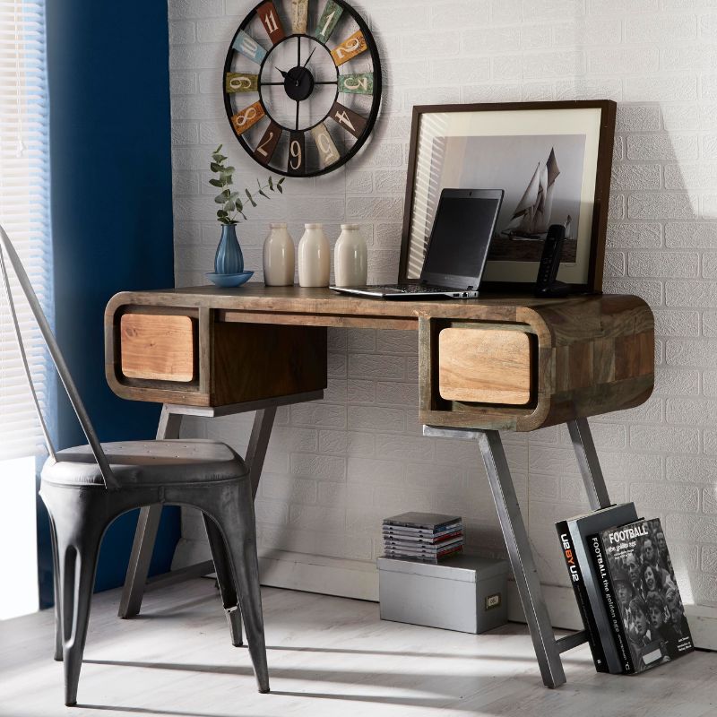 A wooden desk with two drawers and a clock placed on top.