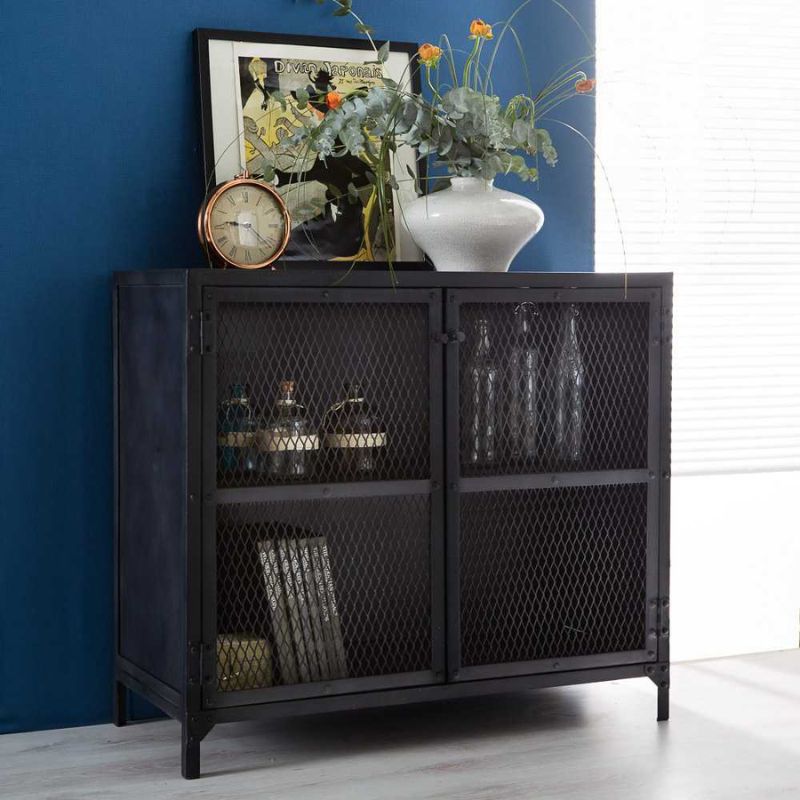 An elegant black cabinet adorned with a vase holding beautiful flowers.