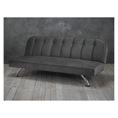 A grey sofa with metal frame and buttoned up seat.