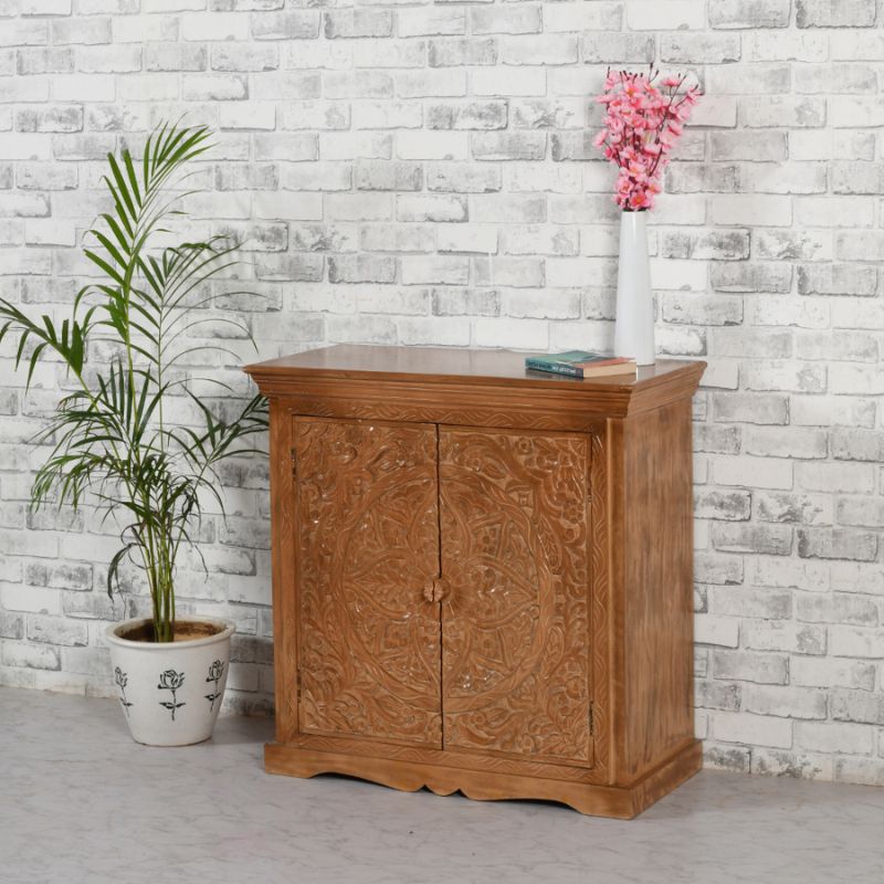 A wooden cabinet with a flower vase on the side.