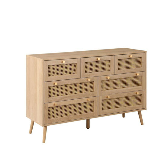 Wooden dresser with drawers and top, perfect for storing clothes and accessories in a bedroom.