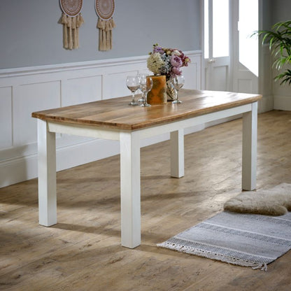 White dining table with wooden top, perfect for modern interiors.