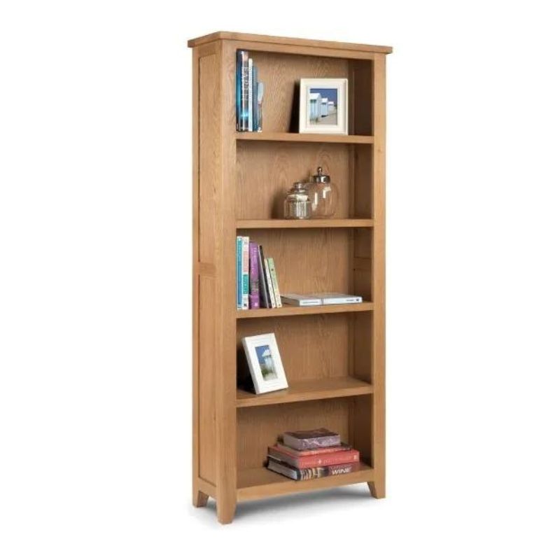 A wooden bookcase filled with neatly arranged books on its shelves, showcasing a warm and inviting atmosphere.
