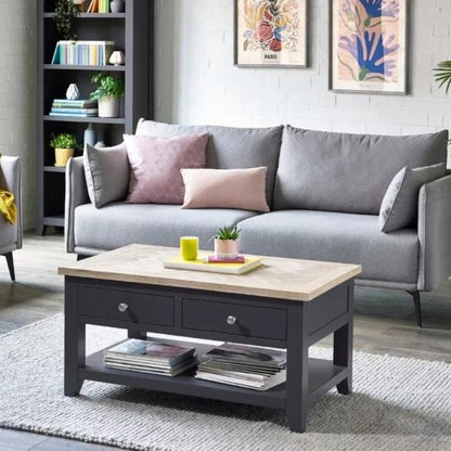 A grey couch paired with a coffee table, set in a cozy living room environment, creating a welcoming atmosphere.