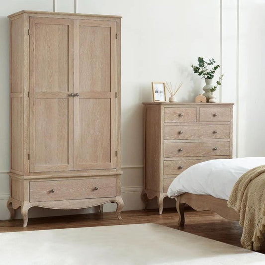 A wooden armoire featuring two doors and multiple drawers, showcasing a classic and elegant design for storage.
