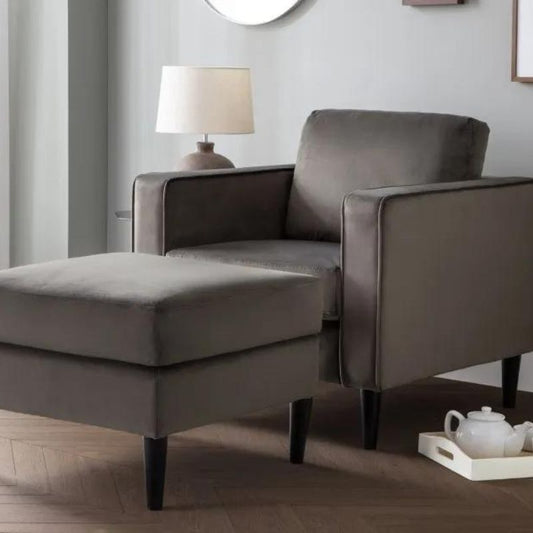 A grey chair and matching ottoman positioned elegantly in a well-lit room, creating a cozy and inviting atmosphere.