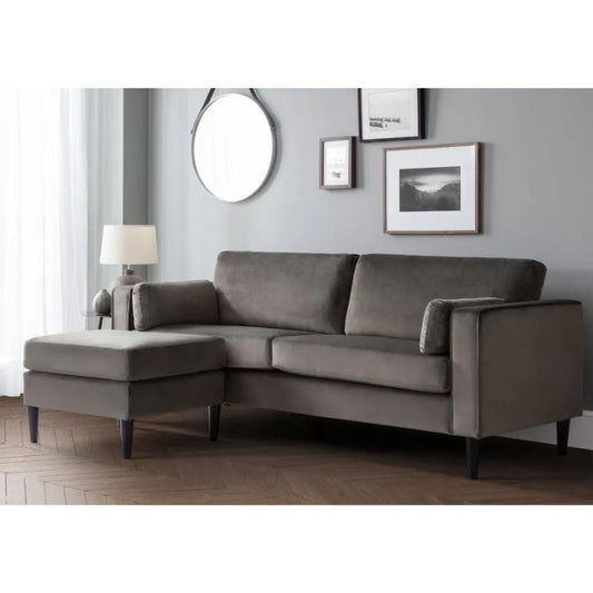 A stylish modern grey sectional sofa with an ottoman, designed for comfort and elegance in contemporary home interiors.