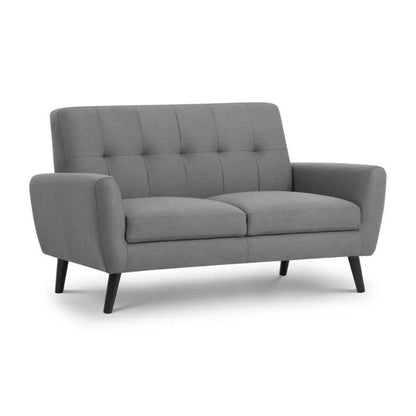 A modern grey sofa featuring sleek black legs and arms, showcasing a stylish and contemporary design.