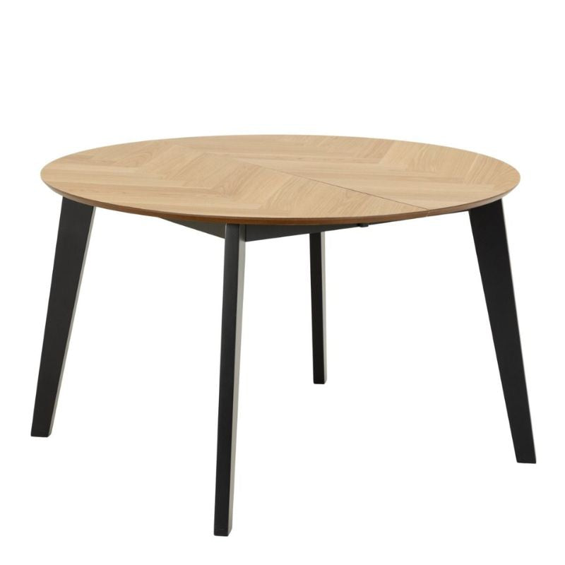 A round table featuring black legs and a wooden top, elegantly designed for modern dining or workspace settings.