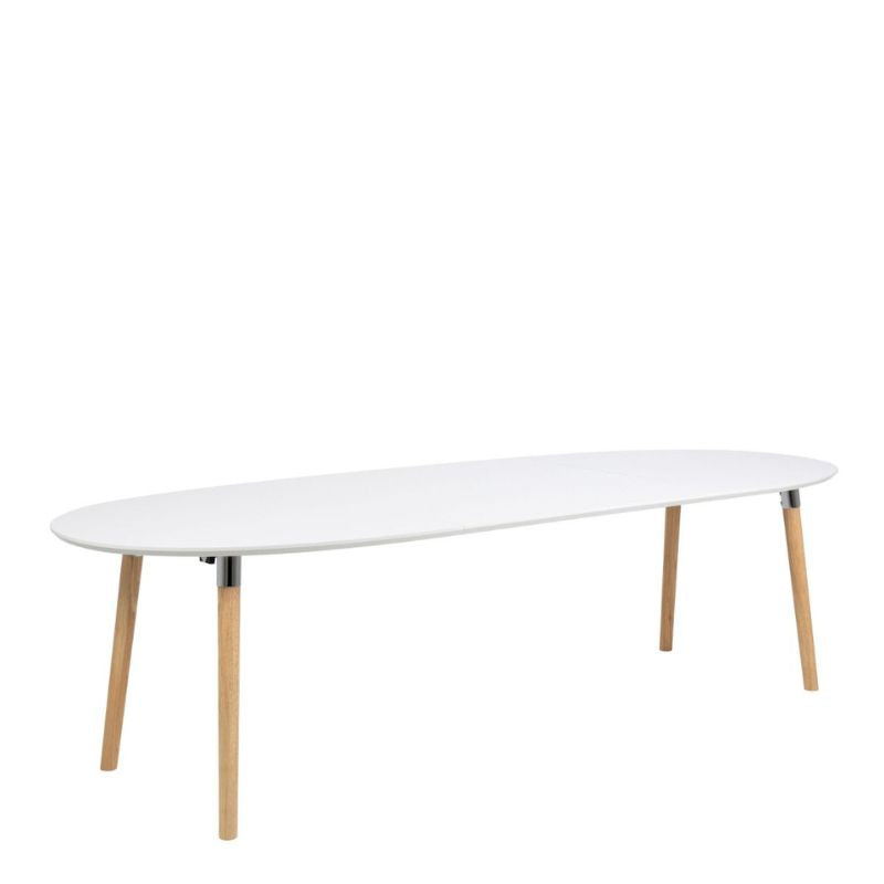 A white table featuring a white top and wooden legs, elegantly designed for a modern interior setting.