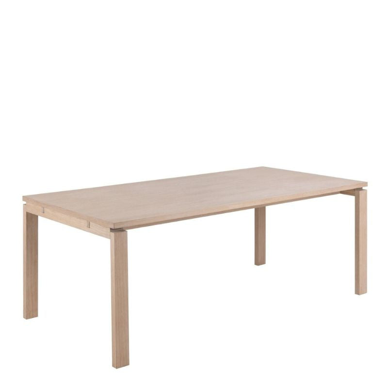 A wooden table featuring a sturdy base and a sleek rectangular top, suitable for various settings and purposes.