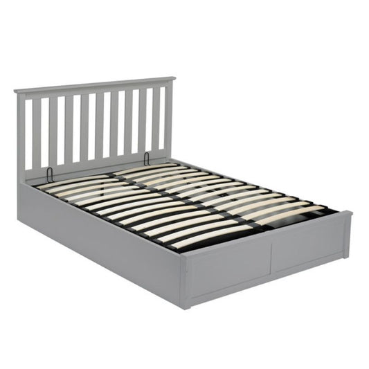 A wooden slat bed frame supporting a comfortable mattress, showcasing a simple and elegant design for restful sleep.