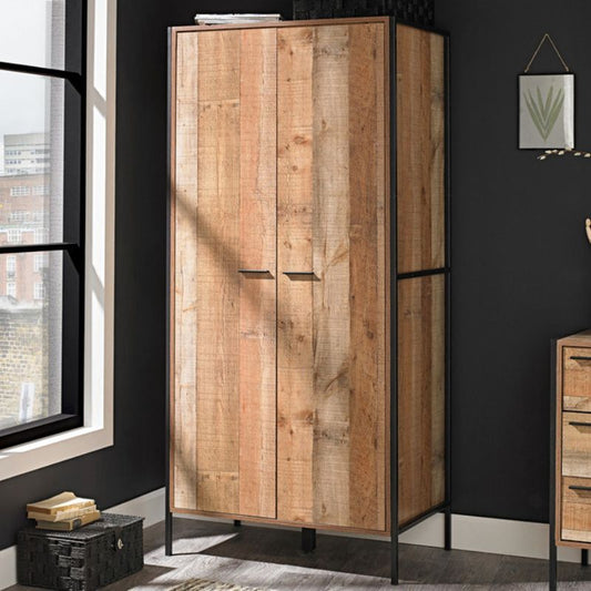 A wooden wardrobe featuring two doors and a single drawer, showcasing a classic and functional design.