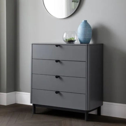 A grey chest of drawers topped with a decorative vase, showcasing a minimalist and elegant design.