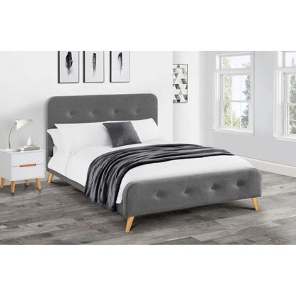 A stylish bed featuring a grey headboard and footboard, elegantly designed for a modern bedroom aesthetic.