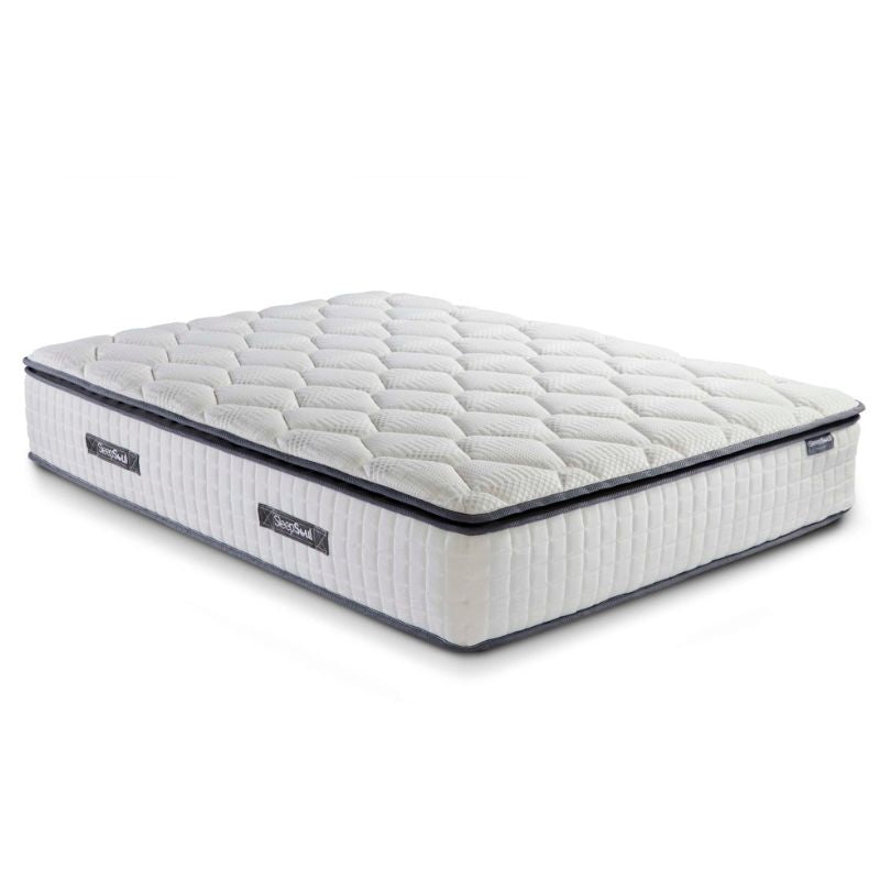 A white mattress displayed prominently, showcasing its clean and simple design.