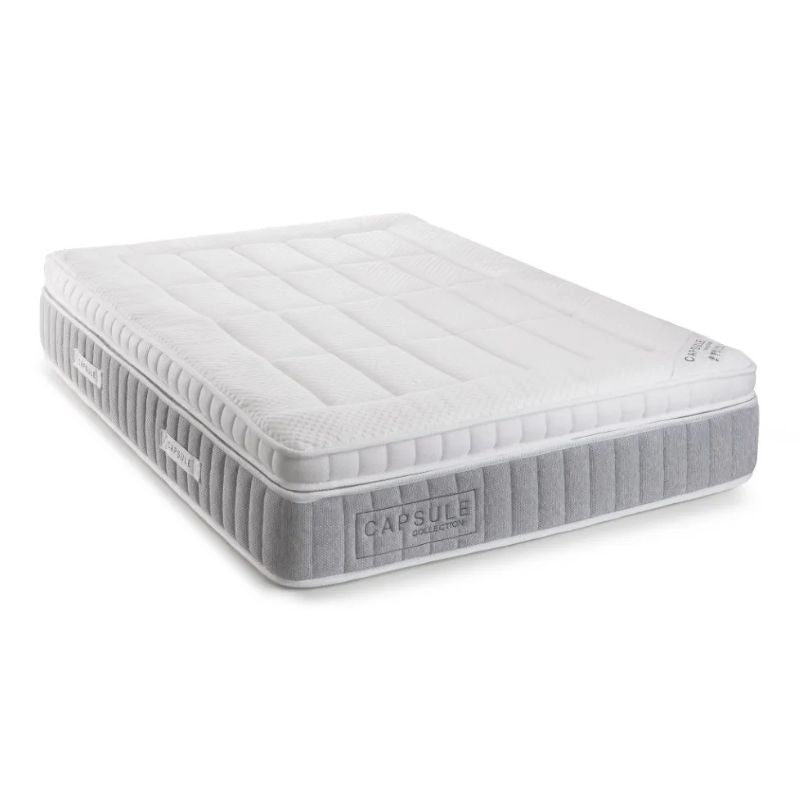 A white mattress featuring a smooth surface, highlighting its minimalist aesthetic.