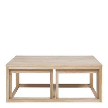 A solid wood coffee table showcasing natural grain and craftsmanship, enhancing the elegance of the living space.