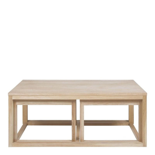 A solid wood coffee table showcasing natural grain and craftsmanship, enhancing the elegance of the living space.