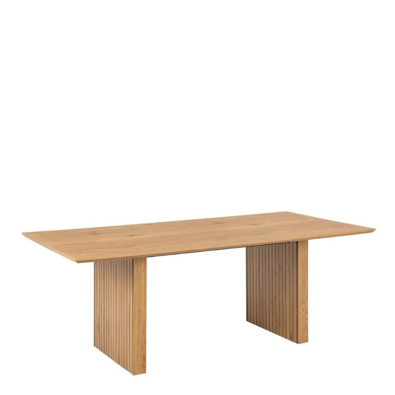 A wooden table featuring a sturdy base and a square top, elegantly designed for various settings.