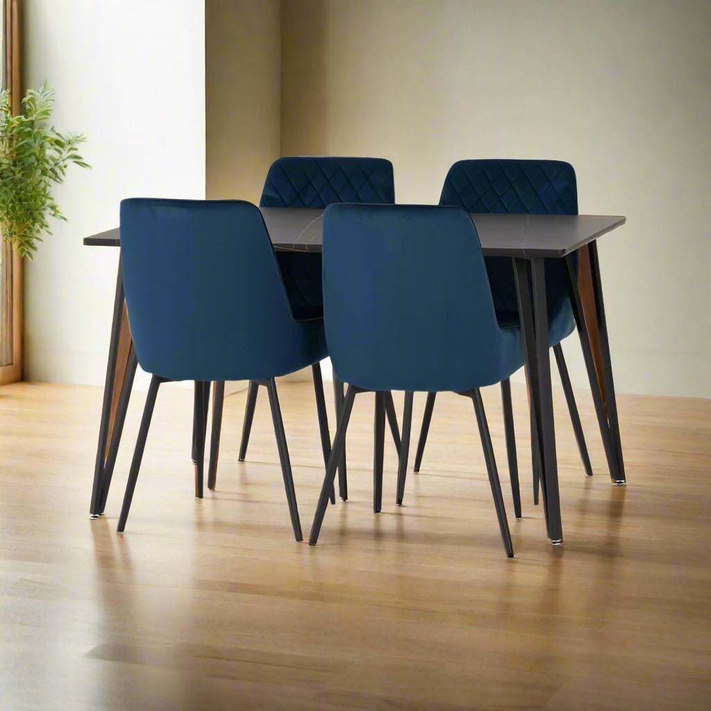 A blue dining table surrounded by four matching chairs, creating a vibrant and inviting dining space.