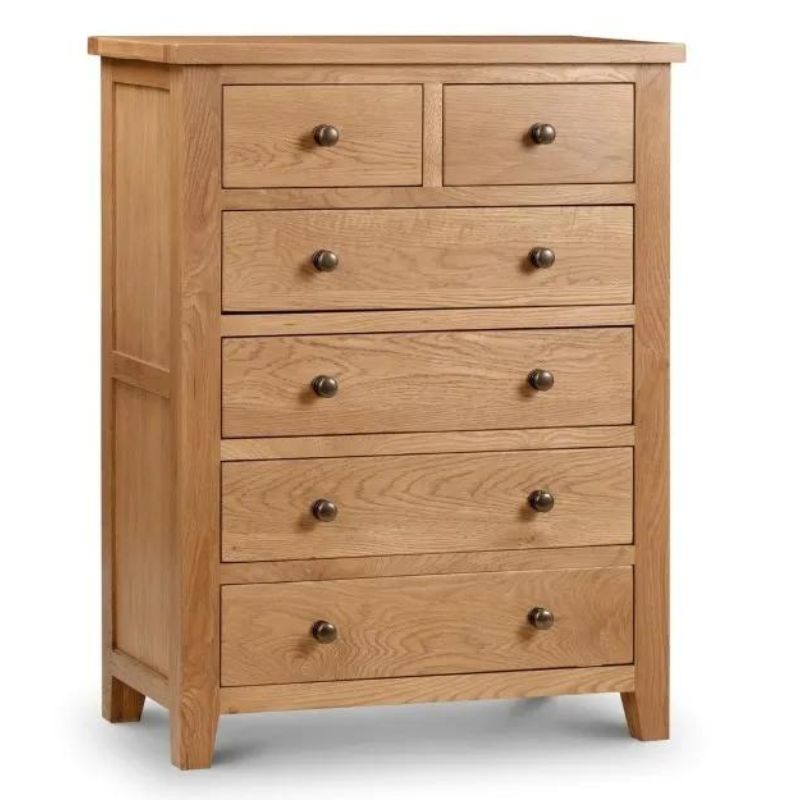 A solid wood oak chest of drawers showcasing a classic design and sturdy construction, perfect for any bedroom decor.