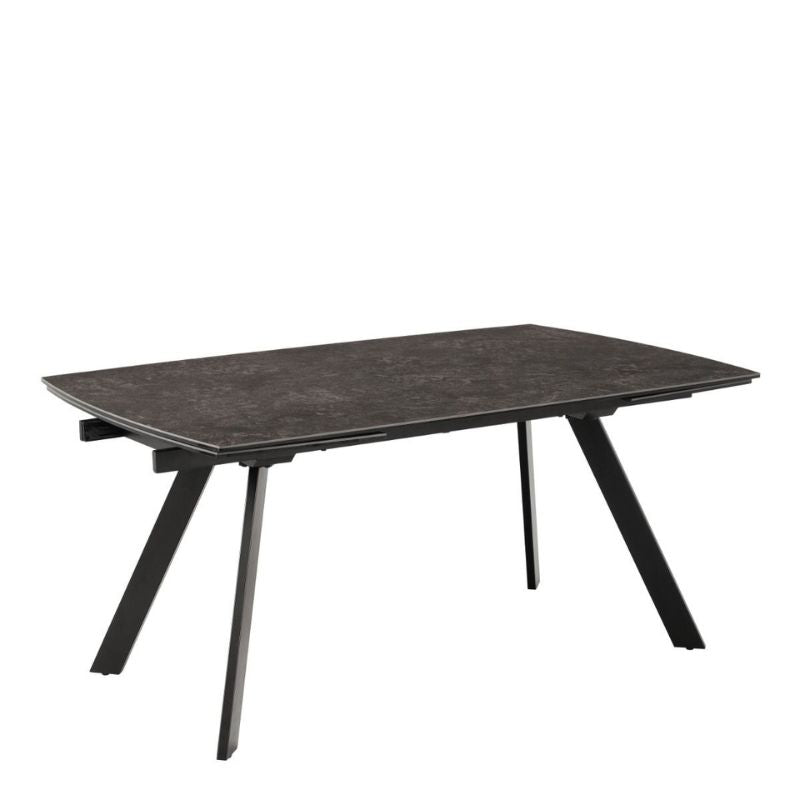 A black table with a metal base and a black top.