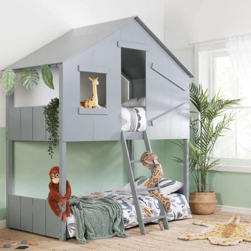 A children's bedroom with a bunk bed and a jungle themed bed, perfect for siblings sharing a room.