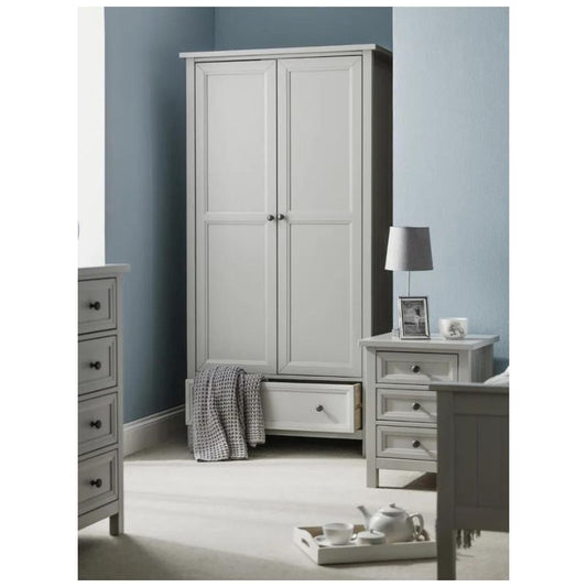 A serene bedroom featuring a white dresser and a stylish grey wardrobe, creating a modern and elegant atmosphere.