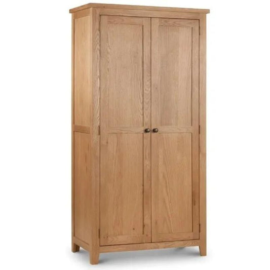 A solid wood oak wardrobe showcasing its sturdy construction and elegant design, perfect for any bedroom setting.