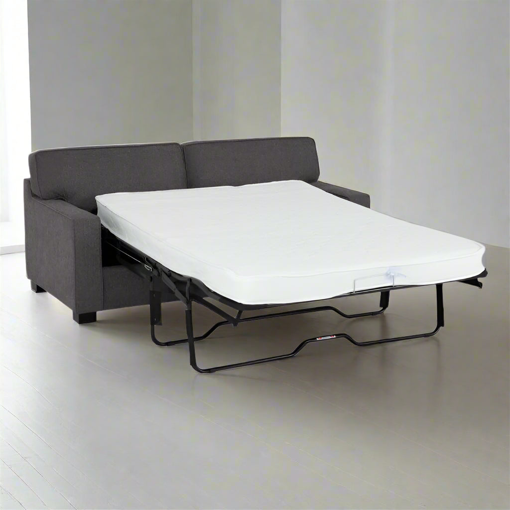 A sofa bed featuring a comfortable mattress placed on top, ideal for versatile seating and sleeping arrangements.
