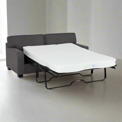 A sofa bed featuring a comfortable mattress placed on top, ideal for versatile seating and sleeping arrangements.
