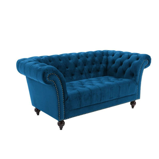 Elegant blue velvet chesterfield sofa.