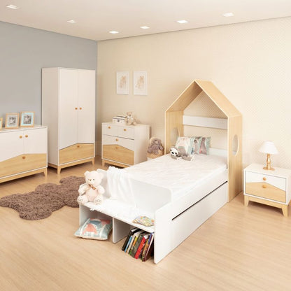 Child's bedroom with bed, dresser, and wooden floor.