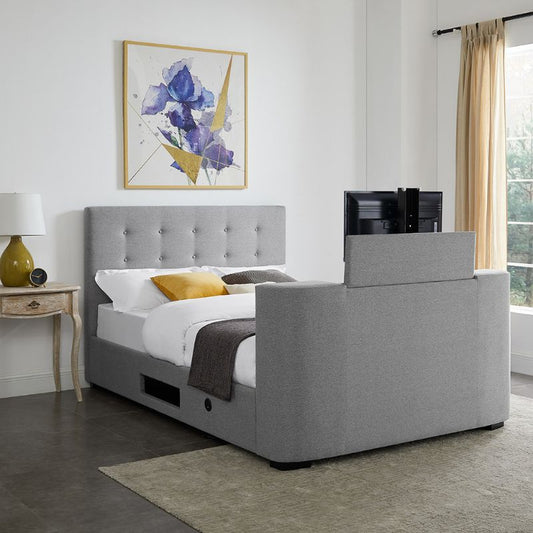 A sleek modern bed with a built-in TV stand.